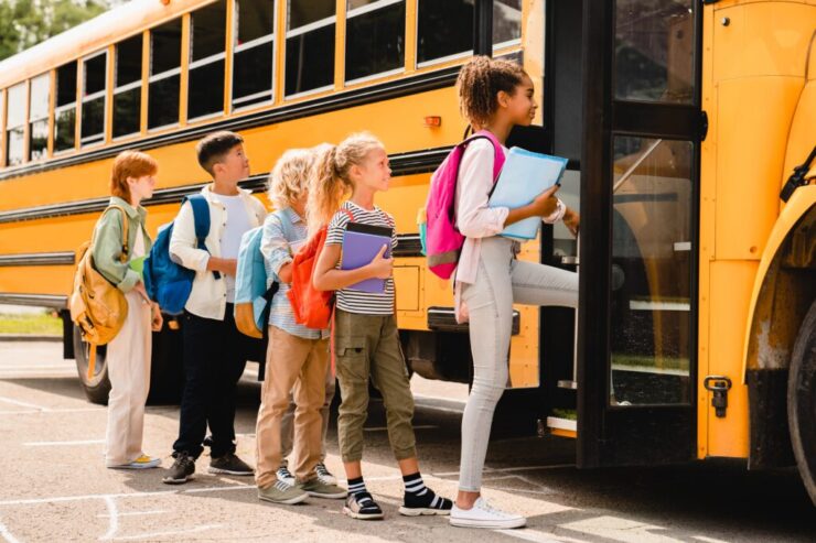 Schoolchildren,Kids,Pupils,Group,Of,Mixed-race,Classmates,Boarding,School,Bus